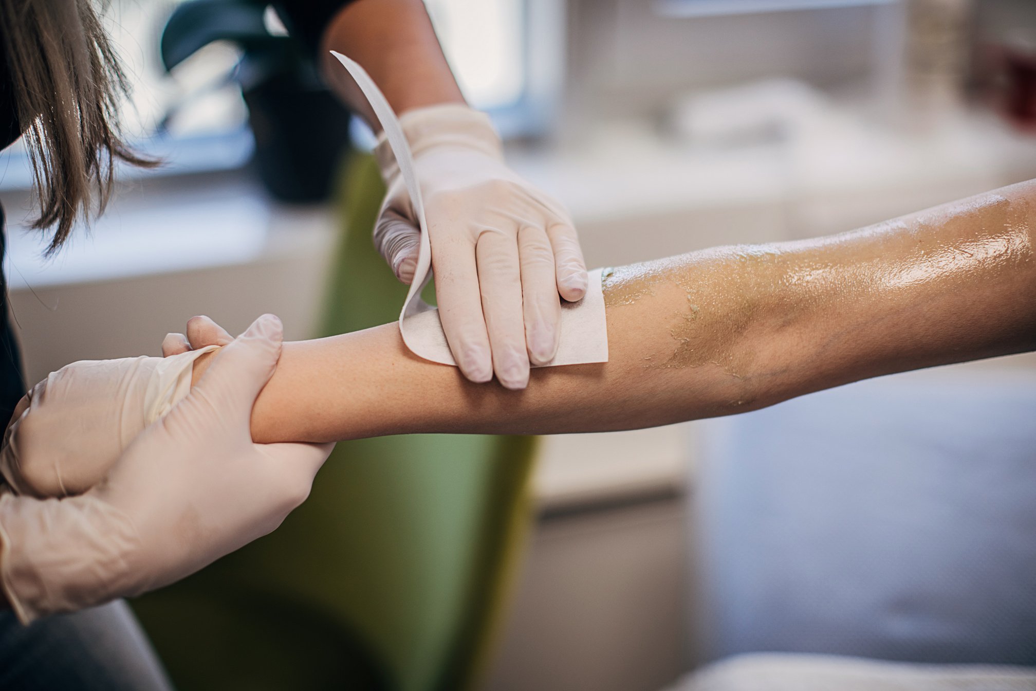 Close up of arm waxing