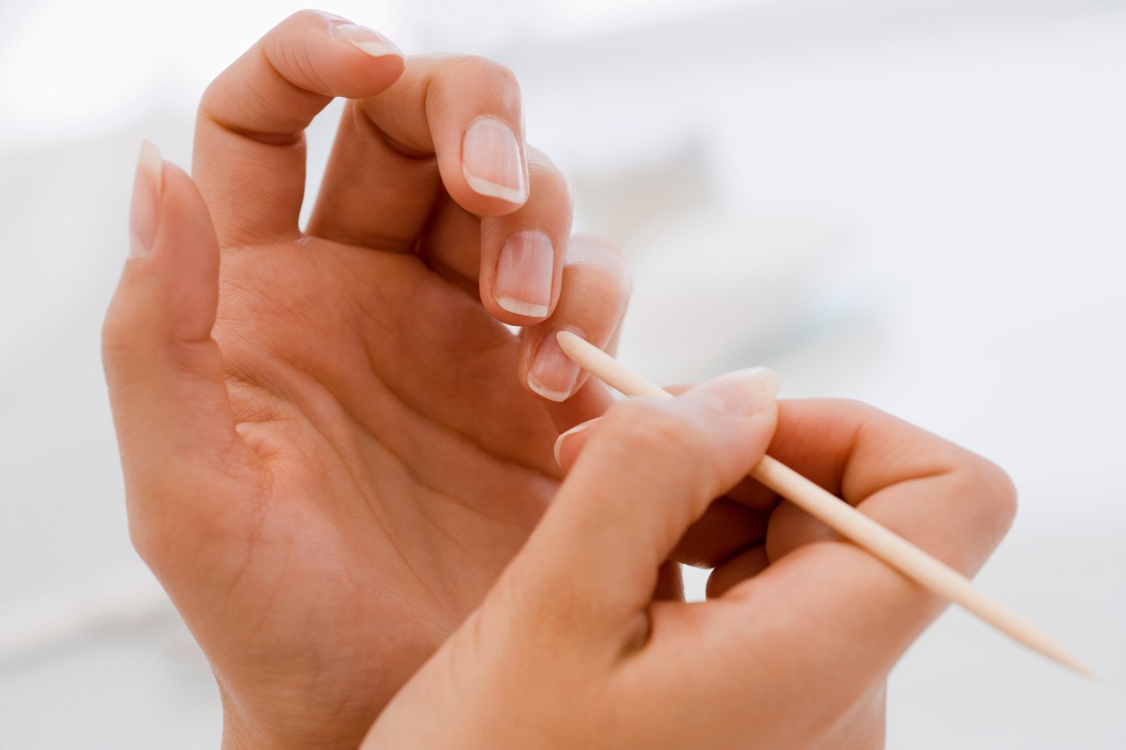 Pushing cuticle of fingernail